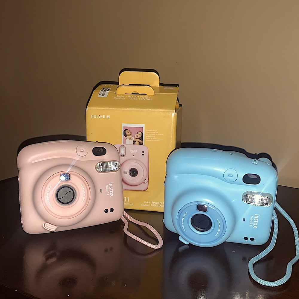 Like New INSTAX mini 11; 1 blush pink with box. 1 baby blue w/o box.